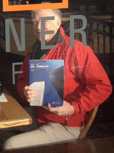 An image of me advertising the pamphlet Beyond Misinformation by Architects and Engineers for 9/11 Truth at the Corner Café on First Hill in Seattle, Washington