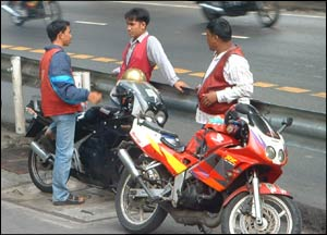 Photographic image of a motorbike-taxi syndicate in Bangkok tuk-tuk