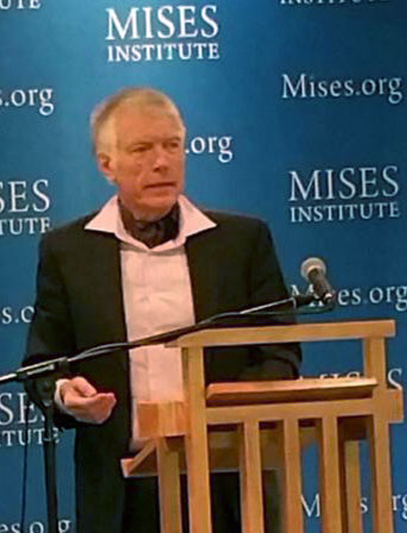A photograph of me presenting my paper at the Ludwig von MIses Institute