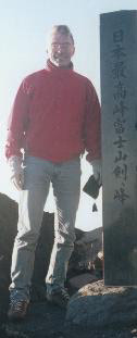 Picture of self standing next to the altitude marker of Mt. Fuji